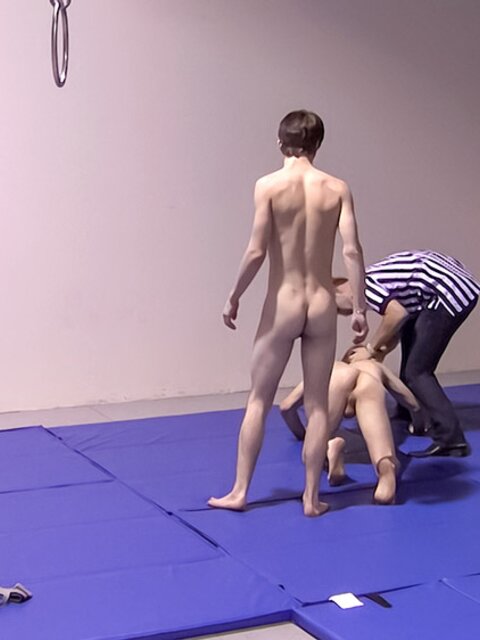 Master Tye watches Lester Braxston and Adam Clark wrestling match