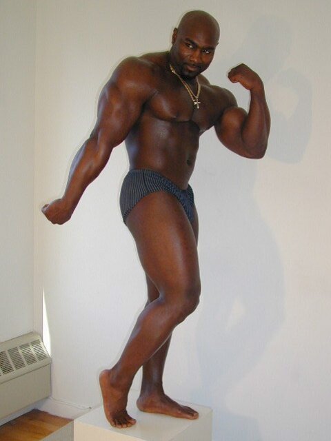 Black and muscled Dynamite shows off bare feet