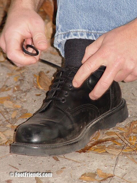 Duke reveals his thick soles and toes after removing his black socks