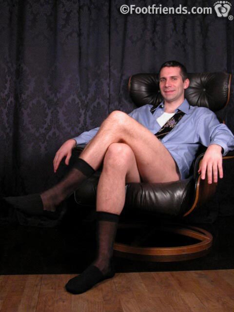 Jonathan shows off his business chic style with sheer socks and size 11 feet