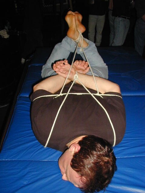 Ken demonstrates bondage techniques on his friend Olivier from China