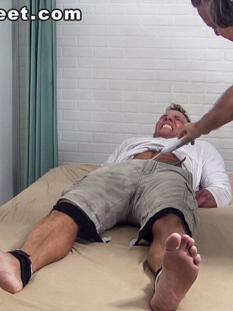 Tristan screams with laughter as he's tickled in bondage