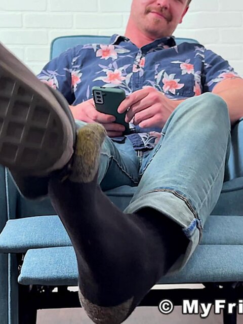 Russ takes off his shoes and socks to display his delectable feet