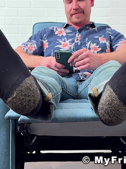 Russ takes off his shoes and socks to display his delectable feet