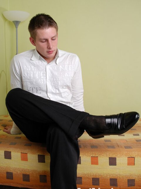 Tommy shows off his smooth young feet in black cotton socks