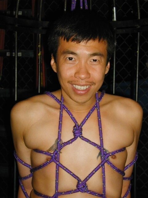 Asian boy discovers the excitement of suspension bondage at the club