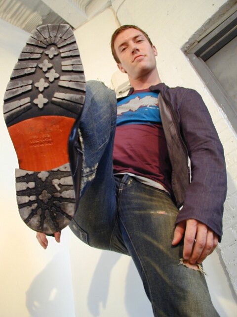 Scott strips socks to reveal his size 10 feet