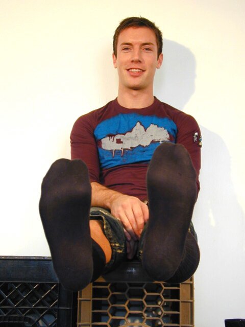Scott strips socks to reveal his size 10 feet