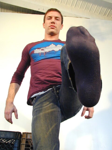 Scott strips socks to reveal his size 10 feet