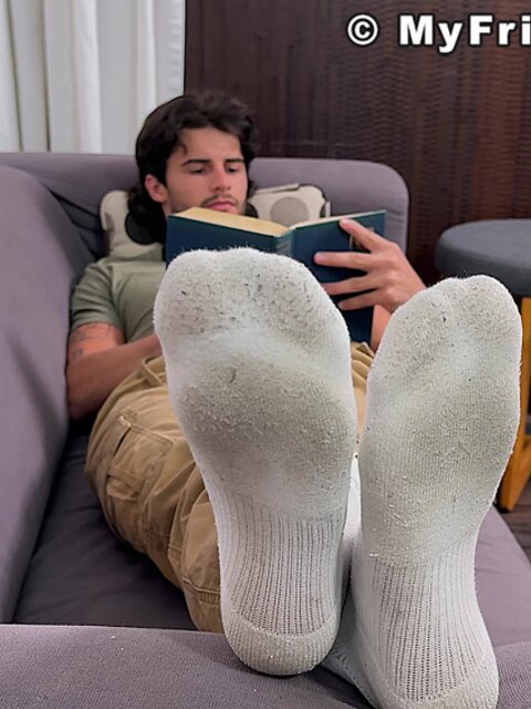 Zeke Stone props his size 10 feet while reading