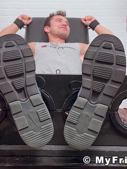 Dan Edwards tickles Travis Maverick’s feet and he laughs