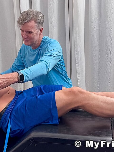 Dan Edwards tickles Travis Maverick’s feet and he laughs