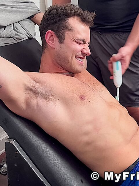 Dan Edwards tickles Travis Maverick’s feet and he laughs