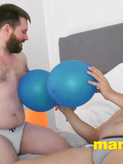 Leo Blue rubs balloons on Kaleb DeWulf’s belly