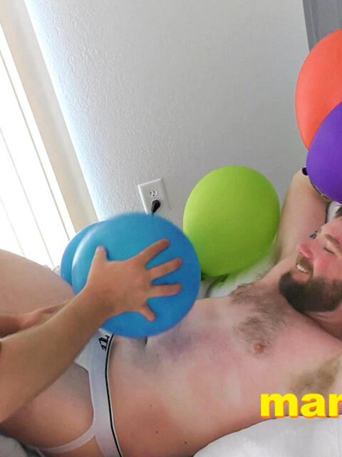 Leo Blue rubs balloons on Kaleb DeWulf’s belly