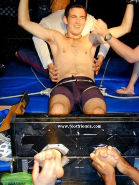 Ken tickles Alex in stocks and makes him laugh