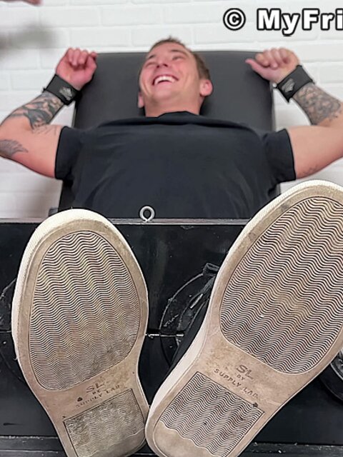 Tyler French giggles as Dan Edwards tickles his sides