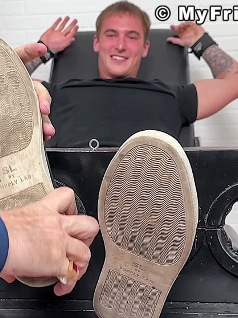 Tyler French giggles as Dan Edwards tickles his sides