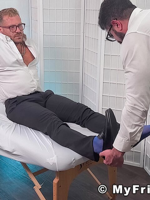 Dr. Riley strokes cock as Gareth licks his soles