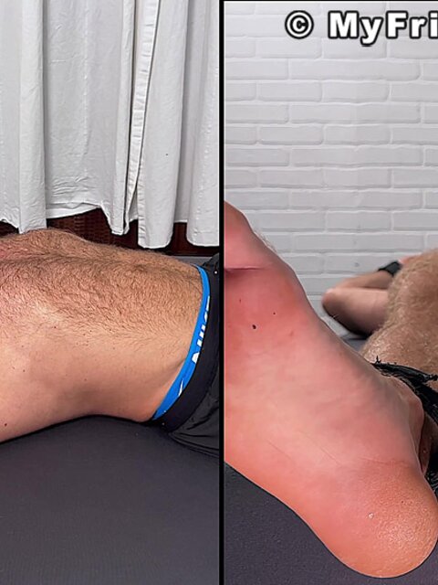 Daniel squirms as Dan Edwards tickles his bare feet