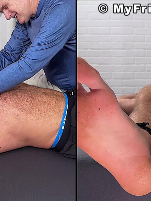 Daniel squirms as Dan Edwards tickles his bare feet