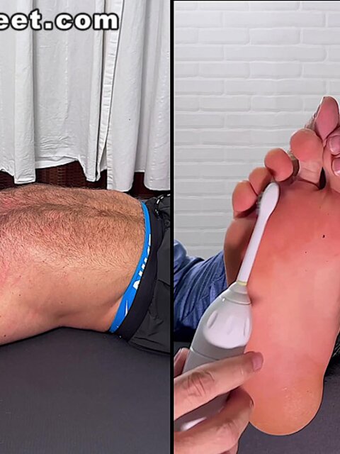 Daniel squirms as Dan Edwards tickles his bare feet