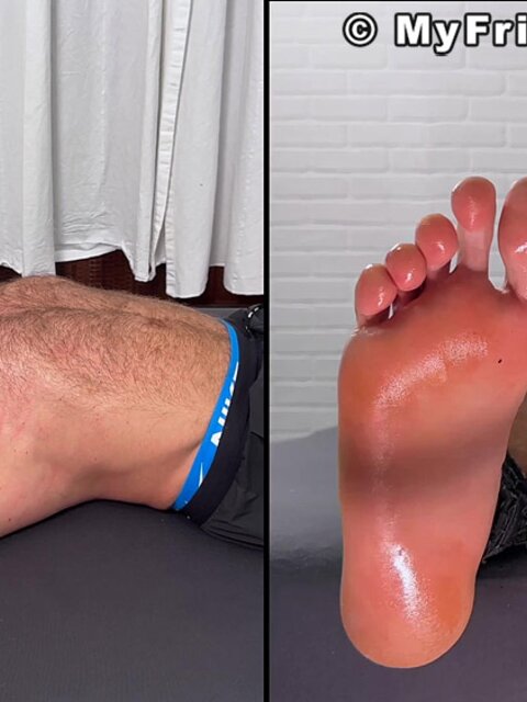 Daniel squirms as Dan Edwards tickles his bare feet