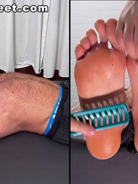 Daniel squirms as Dan Edwards tickles his bare feet
