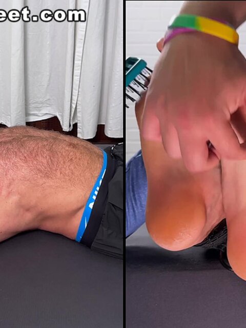 Daniel squirms as Dan Edwards tickles his bare feet