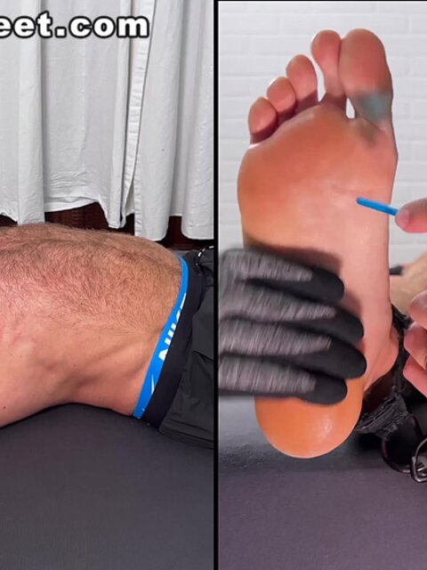 Daniel squirms as Dan Edwards tickles his bare feet