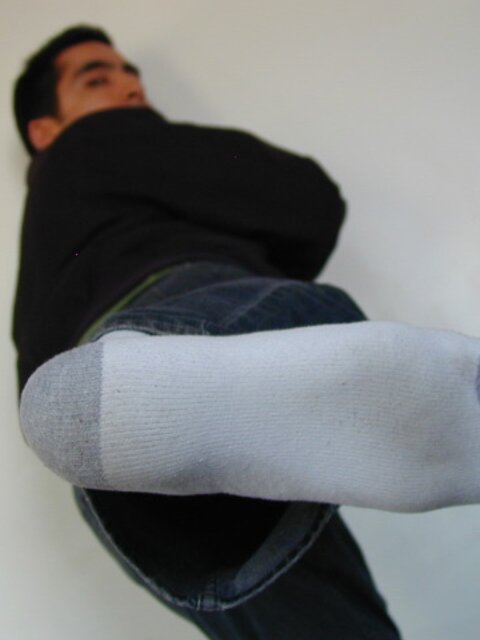 Sebastian shows his sweaty white socks after gym