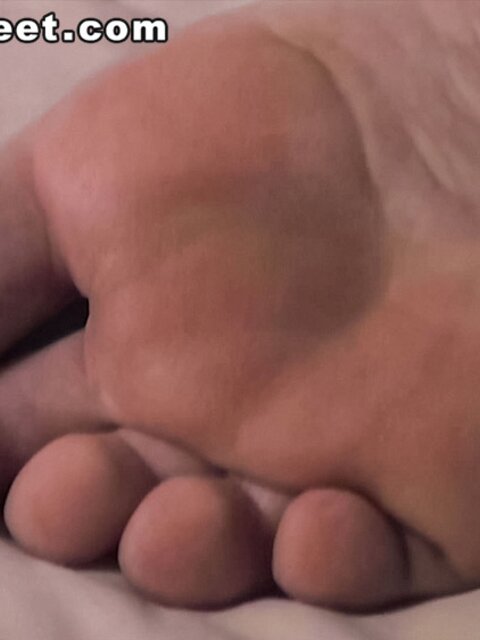 Hogan displays his smooth bare feet for your pleasure