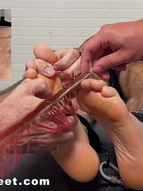 Chase Lachance giggles as Dan Edwards tickles his feet