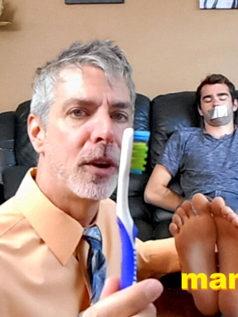 Kody Tracer squirms as Richard Lennox tickles with brush