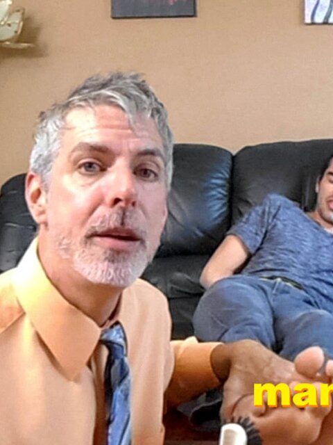 Kody Tracer squirms as Richard Lennox tickles with brush