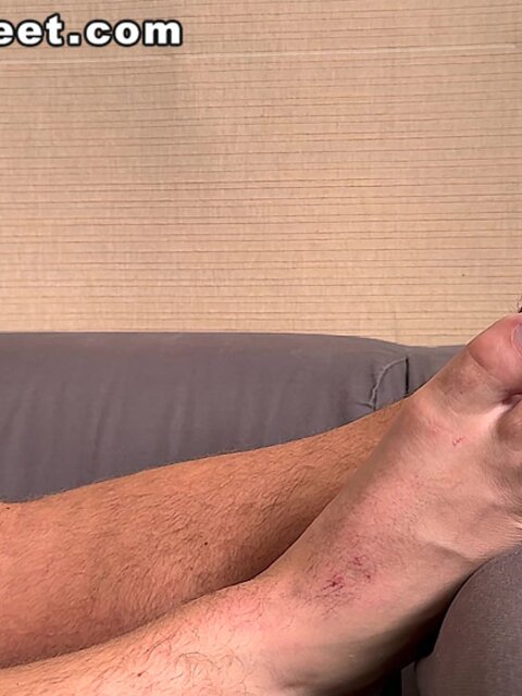Drew Harper enjoys book while you watch his feet