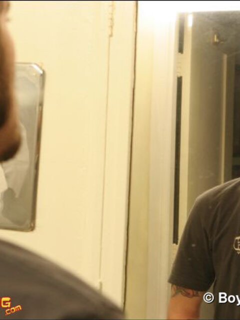 Zack smokes a cigarette while shaving in bathroom
