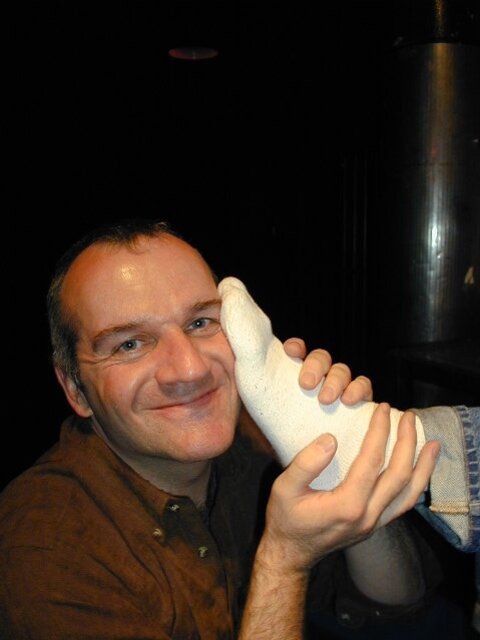 Tommi balances Alan Pratt with his size 14 feet