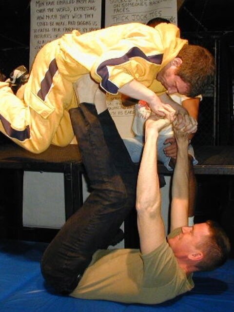 Tommi balances Alan Pratt with his size 14 feet