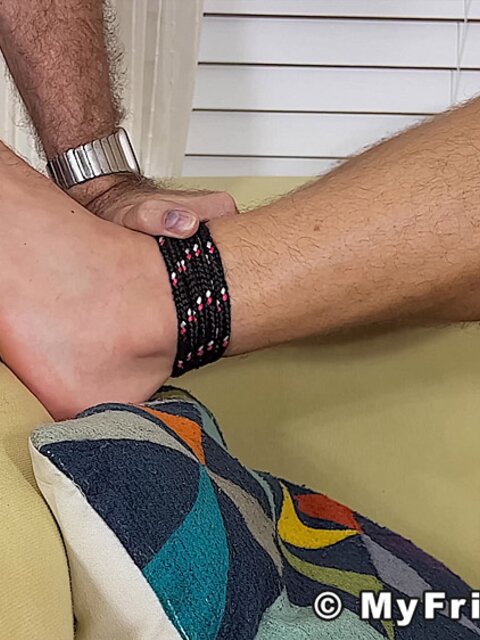 Dan Edwards tickles Clay’s size 12 feet with tools