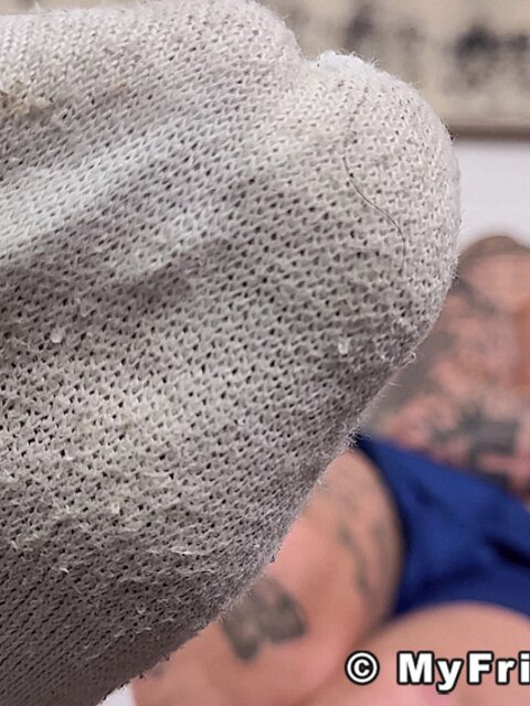 Tyler French shows his white socks and curls his toes