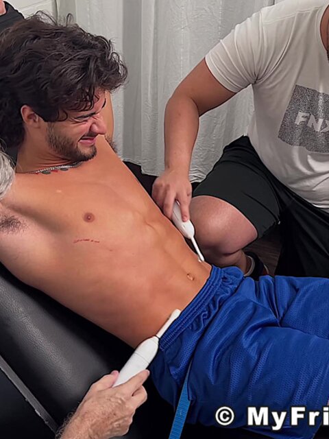 Dan Edwards tickles Zeke Stone’s bare feet with brushes