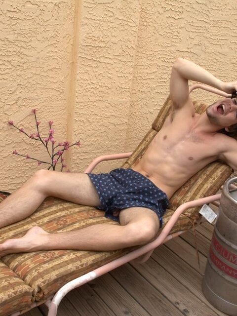 Beer in hand, Zack Randall jerks his uncut cock and cums on the keg