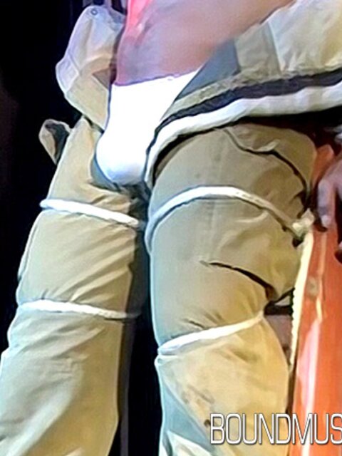 Duke Rivers is gagged and bound, showing off his big body