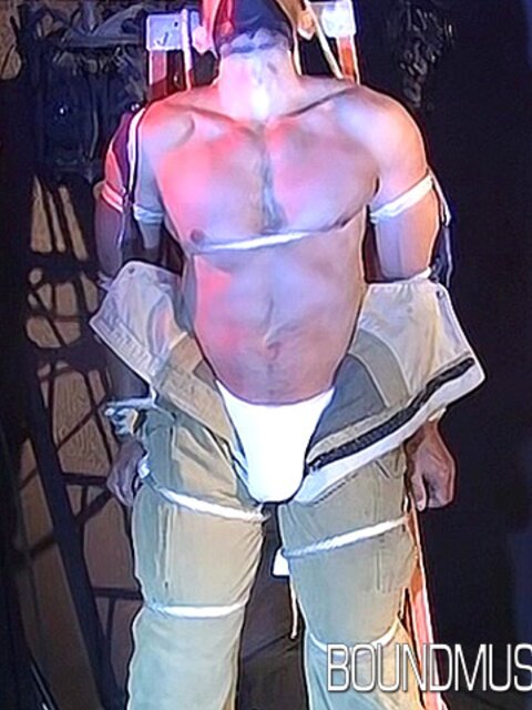 Duke Rivers is gagged and bound, showing off his big body