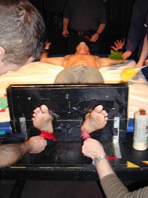 Jessie laughs at Dan’s ticklish feet before both get locked in stocks