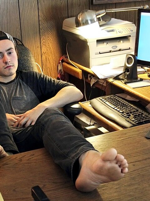Ty Evans strips in the office and jerks his big cock over the desk