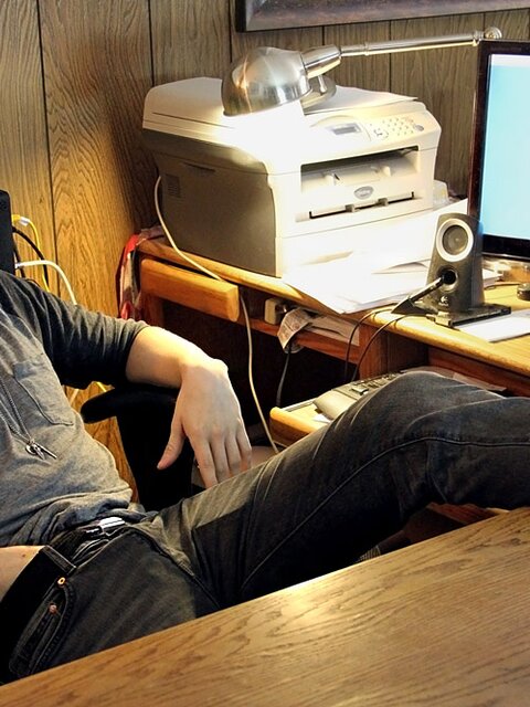 Ty Evans strips in the office and jerks his big cock over the desk