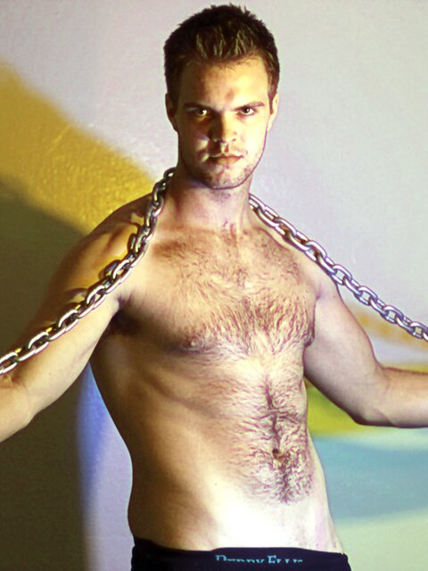 Billy Club teases with sexy poses and soft lighting in a hot gym shoot