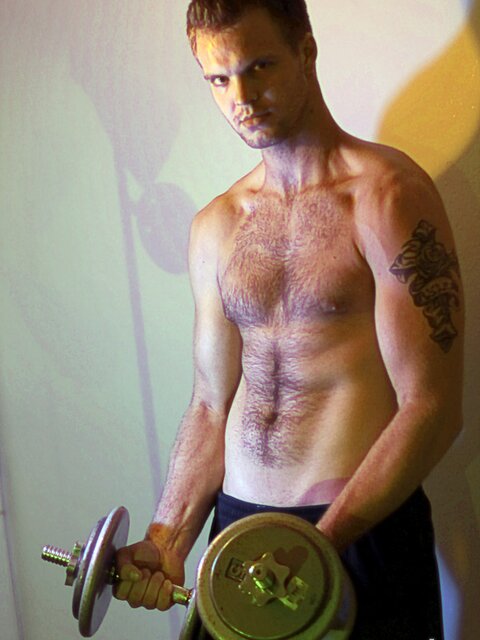 Billy Club teases with sexy poses and soft lighting in a hot gym shoot